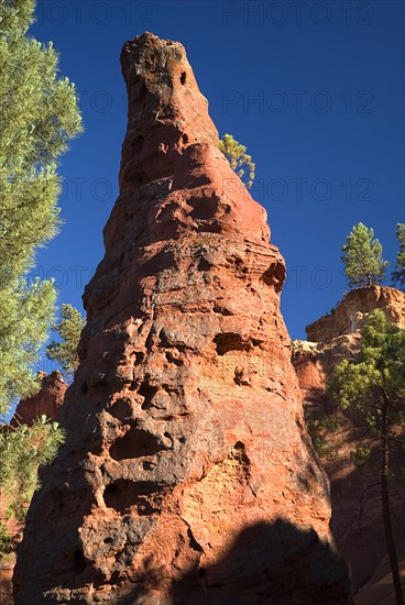 FRANCE, Provence Cote d’Azur, Le Sentier des Ocres (The Ochre Footpath) , "A tall thin, eroded pinnacle of rock in the area known as the Needle Cirque"