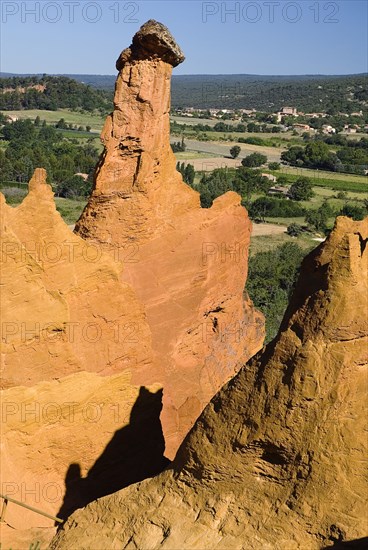 FRANCE, Provence Cote d’Azur, Vaucluse, Cheminee de Fee or Fairy Chimneys.  Eroded ochre rock peaks in area known as Colorado Provencal.