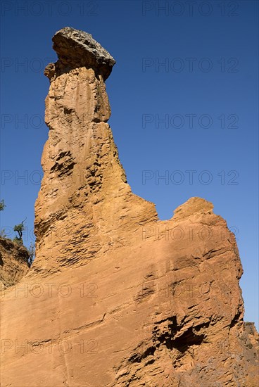 FRANCE, Provence Cote d’Azur, Vaucluse, "Colorado Provencal.  Cheminee de Fee or Fairy Chimneys.  Tall, eroded ochre rock pinnacle."