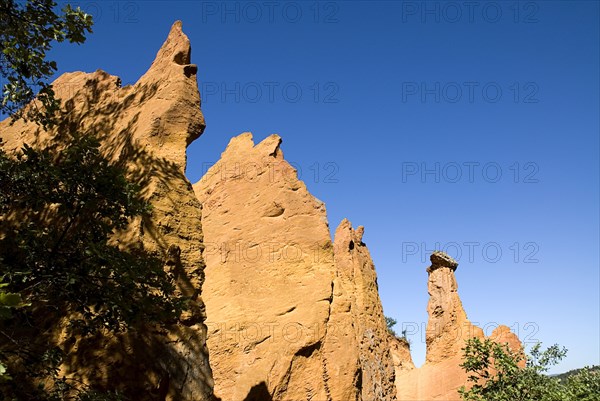 FRANCE, Provence Cote d’Azur, Vaucluse, "Colorado Provencal.  Cheminee de Fee or Fairy Chimneys, eroded peaks and columns of ochre rock."