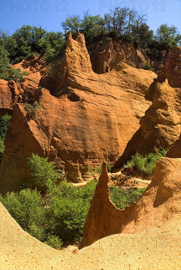 FRANCE, Provence Cote d’Azur, Vaucluse, Colorado Provencal.  Cheminee de Fee or Fairy Chimneys.  Area of eroded ochre rock cliffs and pinnacles from viewpoint