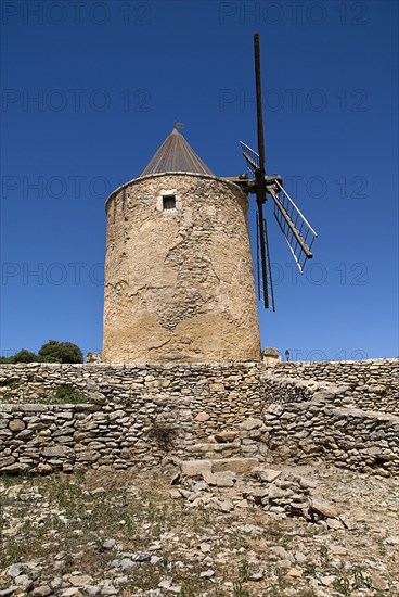 FRANCE, Provence Cote d’Azur, Vaucluse, St-Saturnin-les Apt.  Seventeenth Century windmill in the village.