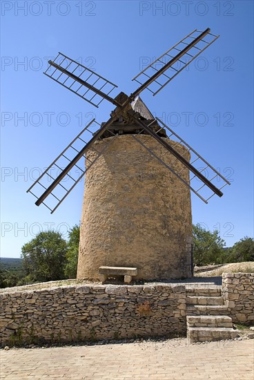 FRANCE, Provence Cote d’Azur, Vaucluse, St-Saturnin-les Apt.  Seventeenth Century windmill in the village.