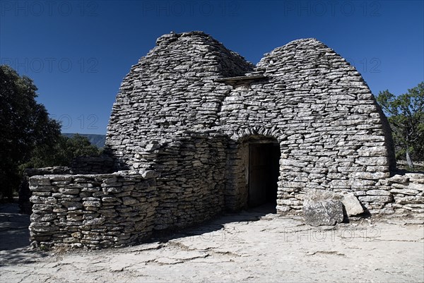 FRANCE, Provence Cote d’Azur, Vaucluse, "Le Village des Bories.  Primitive abandoned village comprising of stone Bories, also known as Gallic Huts each with a specific function, this is a dwelling house."