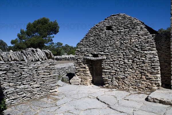 FRANCE, Provence Cote d’Azur, Vaucluse, "Le Village des Bories.  Primitive village comprising of mortarless, stone bories, beehive shaped huts each with a specific agricultural or dwelling purpose.   A reconstructed house dating from the 17th Century . "