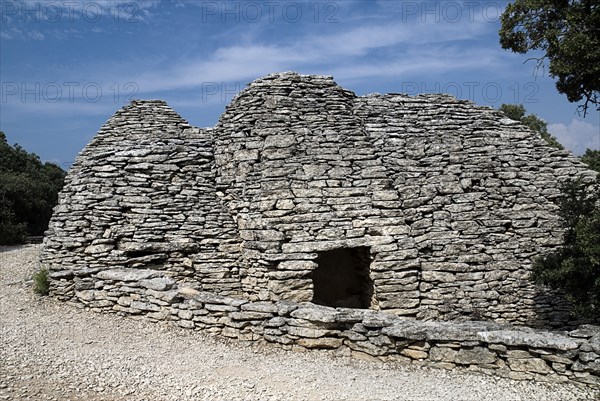 FRANCE, Provence Cote d’Azur, Vaucluse, "Le Village des Bories.  Primitive village comprising of mortarless stone, beehive shaped huts or bories each with a specific purpose.  Pictured is a wine cistern."