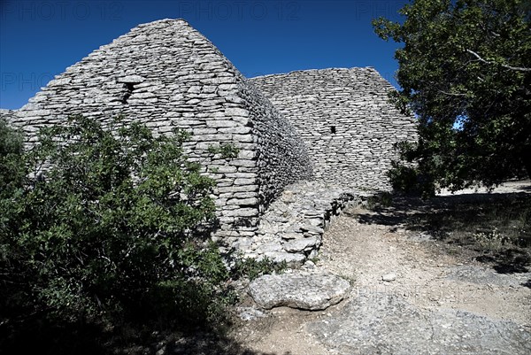 FRANCE, Provence Cote d’Azur, Vaucluse, "Le Village des Bories.  Primitive mortarless stone built, beehive shaped hut in ancient village originally used as  barn.  "
