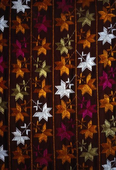 INDIA, Punjab, Textiles, "Detail of pink, orange and white Punjabi Phulkari embroidered textile worn by women."