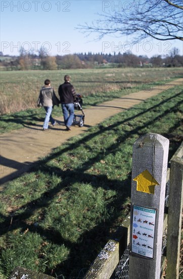 ENGLAND, West Sussex, Midhurst, Country footpath with information sign for ramblers at Cowdray Castle.