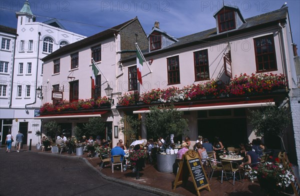 ENGLAND, East Sussex, Brighton, "Donatello Italian restaurant in Brighton Place, The Lanes. People eating and drinking at outside tables"