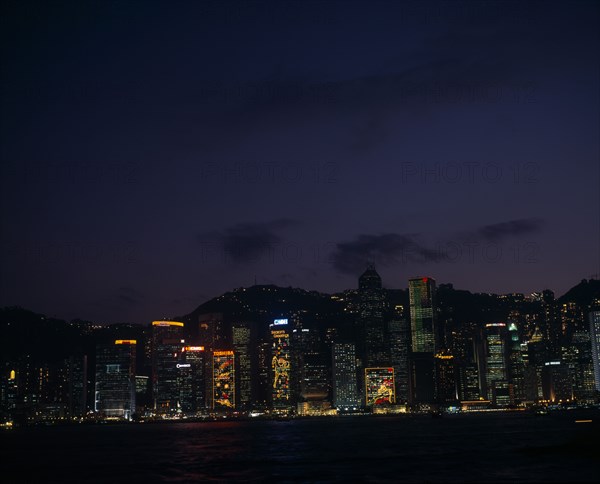 CHINA, Hong Kong, Hong Kong island skyline at night.