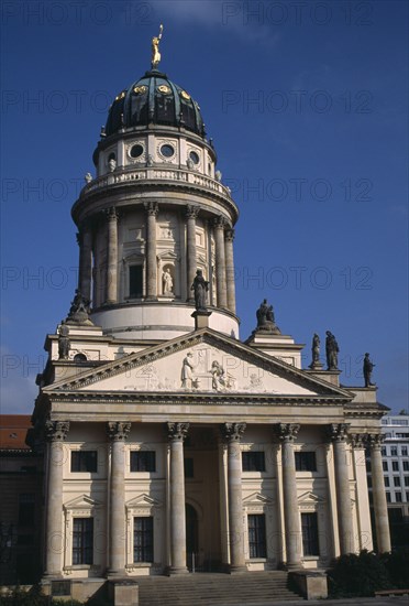 GERMANY, Berlin, Franzosischer Dom in the Gendarmenmarkt  built by the Huguenot community 1701-1705.  Exterior with steps to entrance  and domed roof with statues.