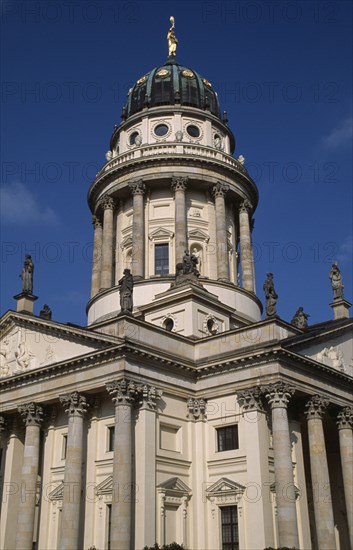 GERMANY, Berlin, Franzosischer Dom in the Gendarmenmarkt  built by the Huguenot community 1701-1705.  Colonnaded exterior with domed tower and statues on roof.