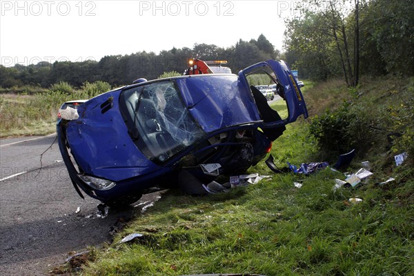 TRANSPORT, Road, Cars, Scene of a road accident invoving a blue Peugeot car.