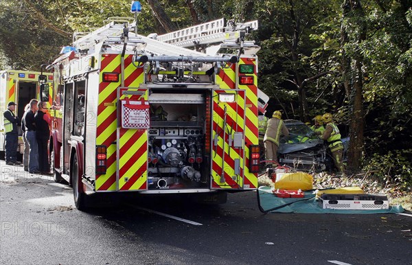 TRANSPORT, Road, Cars, Fire brigade attending the scene of a road traffic accident.