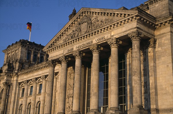 GERMANY, Berlin, The Reichstag  seat of the German Parliament.  Part view of exterior designed by Paul Wallot 1884-1894.  To The German People inscribed above entrance in German.