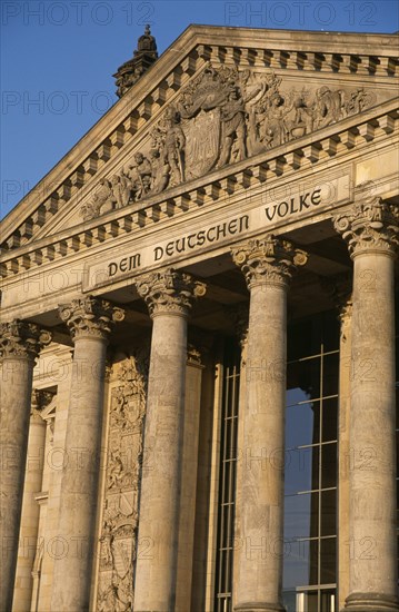 GERMANY, Berlin, The Reichstag  seat of German Parliament.  Part view of colonnaded exterior designed by Paul Wallot 1884-1894.  To The German People inscribed above entrance .