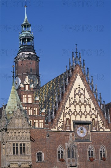 POLAND, Wroclaw, Wroclaw Town Hall dating from the fourteenth century.  Part view of exterior with decorative gable and brickwork  astronomical clock and clock tower.