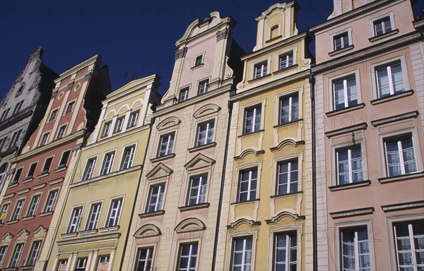 POLAND, Wroclaw, Stare Miasto.  Angled view of pastel coloured building facades in the Old Town Square.
