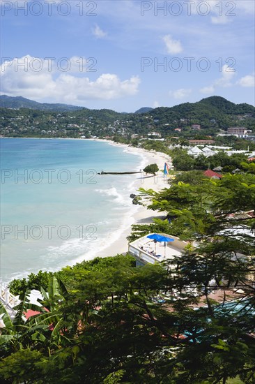 WEST INDIES, Grenada, St George, Waves of the aquamarine sea breaking on the two mile stretch of the white sand Grand Anse Beach