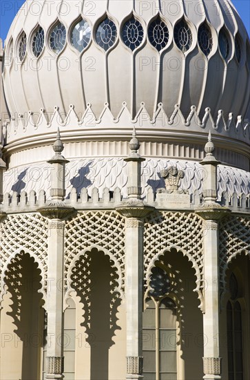ENGLAND, East Sussex, Brighton, The onion shaped dome of the 19th Century Pavilion designed in the Indo- Saracenic style by John Nash commissioned by George Prince of Wales later to become King George IV. The crest of the Prince of Wales sits above the central arch
