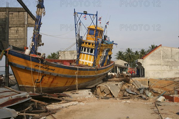 THAILAND, Phang Nga District, Nam Khem, "Tsunami. Boats have been pushed onto the streets which have also been damaged in the village, nothing is left standing. 2500 people are pressumed dead. 125kms north of Phuket on the 2nd Jan"