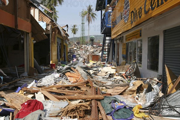 THAILAND, Phang Nga District, Takua Pa, "Tsunami. Phi Phi on the 11th day after the tsunami hit, Shattered shops and restaurants with 2 feet of debris covering what was once the walkway. On the 6th Jan."