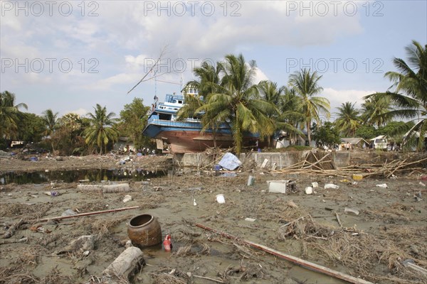 THAILAND, Phang Nga District, Nam Khem, "Tsunami. Boats have been thrown into the center of the village onto the streets and houses which have also been damaged in the village, not much is left standing in the village. 2500 people are pressumed dead. 125kms north of Phuket on the 2nd Jan."