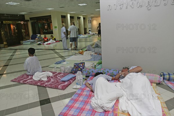 THAILAND, Phang Nga District, Phuket, "Tsunami carnage the day after. Foreign tourists in the Bangkok Phuket hospital, there are so many people that they do not have room and people are lane out where ever they can find space like the corridors and waiting rooms. On the 27th Dec."