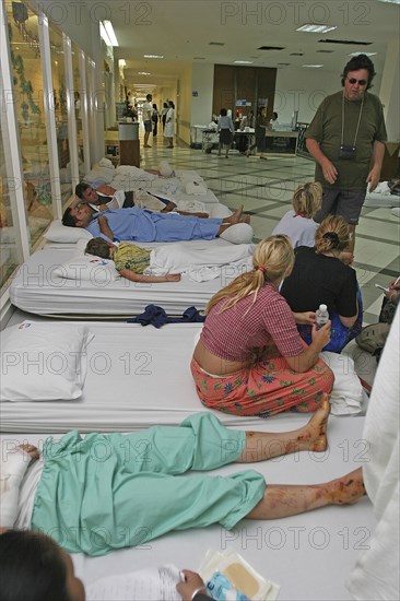 THAILAND, Phang Nga District, Phuket, "Tsunami carnage the day after. Foreign tourists in the Bangkok Phuket hospital, there are so many people that they do not have room and people are lane out where ever they can find space like the corridors and waiting rooms. On the 27th Dec."