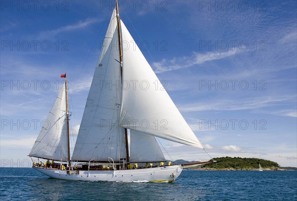 THAILAND, Phuket, "Phuket's King Cup Reggata The Sylvia boat, a 143 foot yacht, with 25 crew, it raced in the Clasic Class, it was first launched in 1925. the captain is Bryce Rasmussen, from Australia. The 2nd Day of the races. Todays race is called. Royal Phuket Marina Race. Royal Phuket marina is another sponser of the event. They started just off Kata Beach, and went the Prapis around koh kaeo Noi, then Koh Hi, then Koh Aeo, Phuket, Thailand. The 19th Phukets kings Cup Reggata is held between the 3rd and the 10th of December."