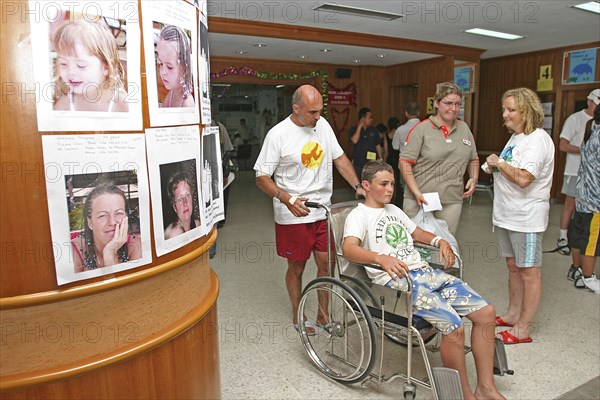 THAILAND, Phuket, "Tsunami. Foreign tourists at the entrance of Vachira hospital, with pictures of missing people posted up. In Phuket town.On the 29th Dec"