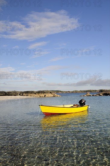 SCOTLAND, Argyll, Isle Of Mull, Yellow boat anchored in clear waters