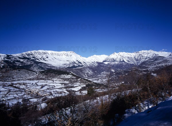SPAIN, Aragon, Pyrenees, Snow covered mountain Macizo de Posets which is 3369 metres 11033 feet high point. The border with France on the right skyline.