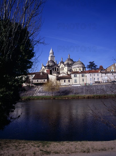 FRANCE, Dordogne, Perigeux, Cathedral of St Front which was restored in the 19th Century dominates the skyline above the medieval quarter seen across River Isle.