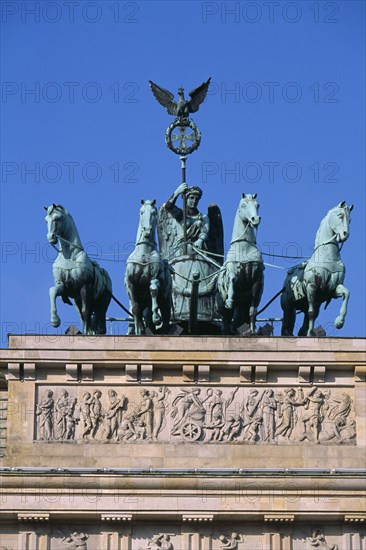 GERMANY, Berlin, "The Brandenburg Gate.  The Quadriga on top of the gate.  Chariot drawn by four horses driven by Victoria, Roman goddess of victory."