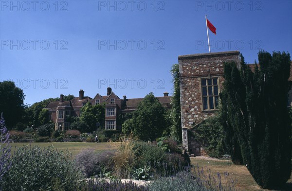 ENGLAND, East Sussex, Glyndebourne, View across the garden towards the country house and opera house near Lewes.