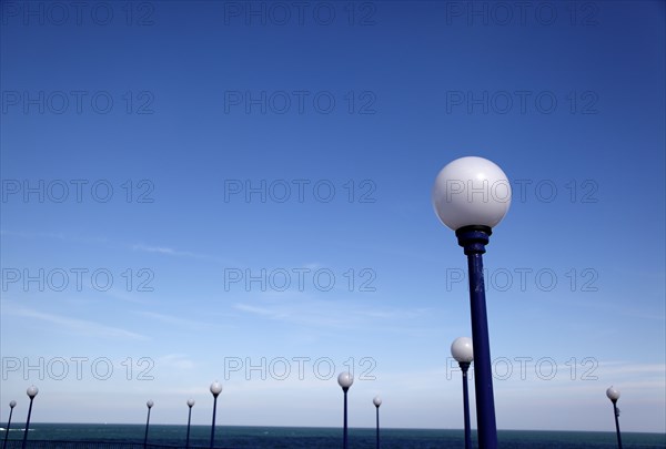 ENGLAND, East Sussex, Eastbourne, Detail of lamps on promenade next to the bandstand..