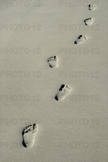 USA, Georgia, Tybee Island, Human footprints in the sand.