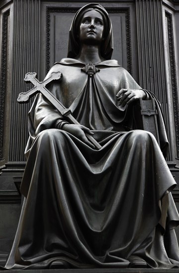 GERMANY, Saxony, Dresden, "Neumarkt, detail of female figure holding a cross at the base of the bronze Statue of King Friedrich August II by Ernst Julius Handel 1867."