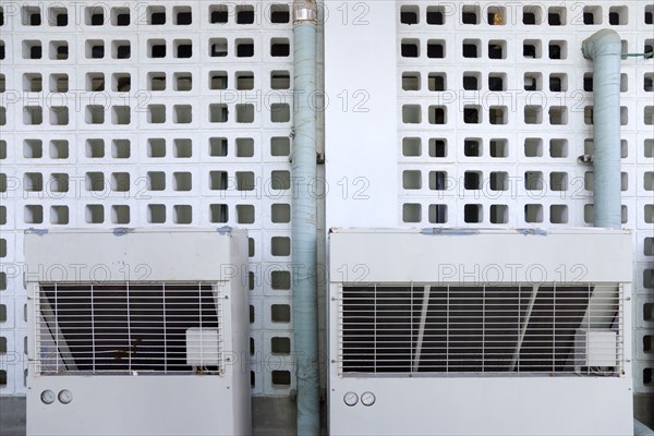 WEST INDIES, St Vincent & The Grenadines, Union Island, Airconditioning units outside an industrial building in Clifton.