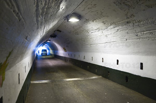 WEST INDIES, Grenada, St Georges, The Sendall Tunnel built in 1894 with pedestrians and cars moving through it.