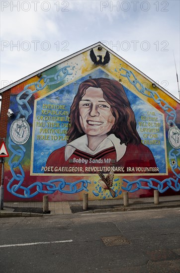 IRELAND, North, Belfast, "Falls Road, Mural of Bobby Sands on the gable end of the Sinn Fein headquarters on the corner of Sevastapol Street."