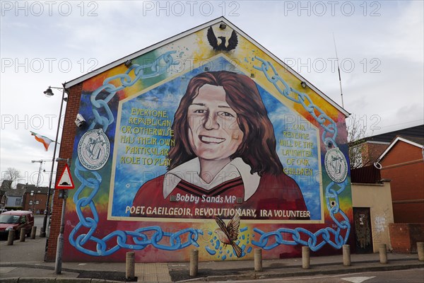 IRELAND, North, Belfast, "Falls Road, Mural of Bobby Sands on the gable end of the Sinn Fein headquarters on the corner of Sevastapol Street"