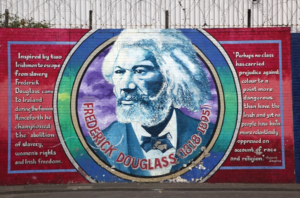 IRELAND, North, Belfast, "West, Falls Road, Political murals painted on walls of the Lower Falls Road area depicting Frederick Douglass who championed the abolition of slavery"