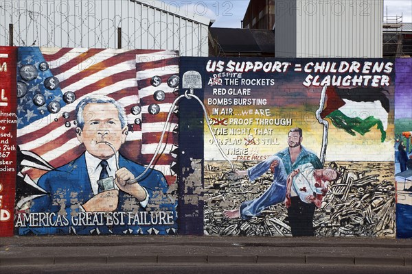 IRELAND, North, Belfast, "West, Falls Road, Political murals painted on walls of the Lower Falls Road area epicting former US President George Bush Junior sucking oil out of the Middle East."