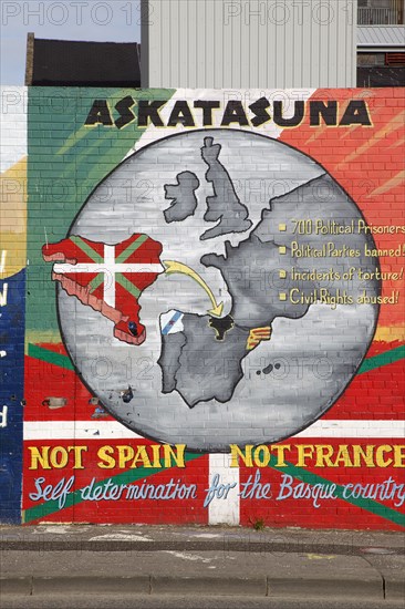 IRELAND, North, Belfast, "West, Falls Road, Political murals painted on walls of the Lower Falls Road area in support of Basque independence form Spain and France."
