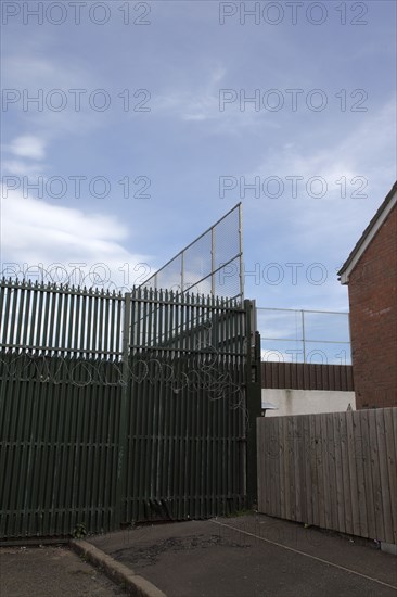 IRELAND, North, Belfast, "West, Falls Road, Peace Line barrier between the Catholic Lower Falls and Protestant Shankill areas"