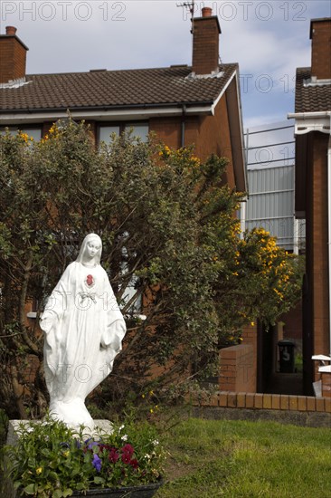 IRELAND, North, Belfast, "West, Falls Road, One of many statues of Mary Our Lady near Peace Line barrier between the Catholic Lower Falls and Protestant Shankill areas."