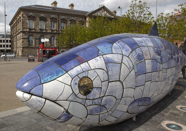 IRELAND, North, Belfast, "Donegall Quay, The Big Fish Sculpture by John Kindness. The scales of the fish are pieces of printed blue tiles with details of Belfasts history. The 10 metre long structure is situated beside the Lagan Weir opposite the old Custom House"